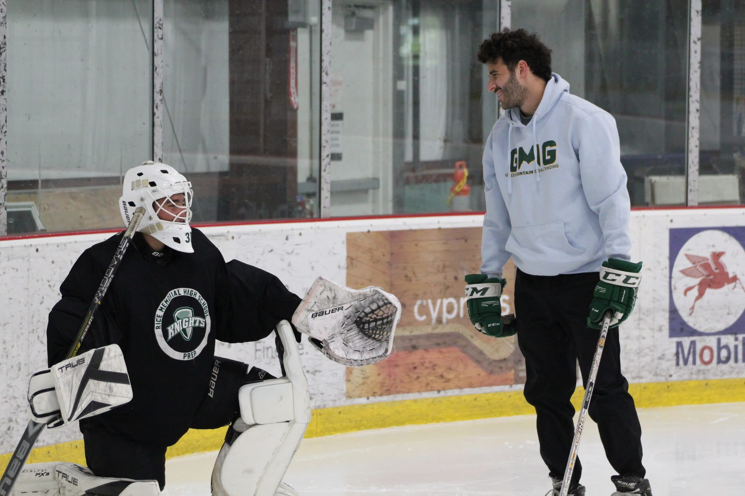 Coach Shea running a goalie drill on the ice