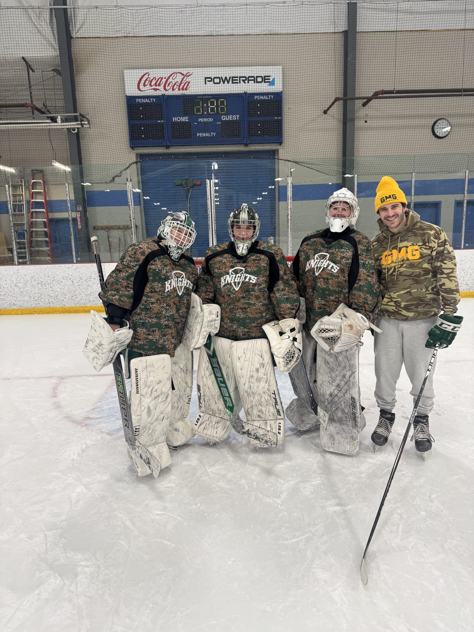 Coach Shea with a group of prep goalies after a clinic