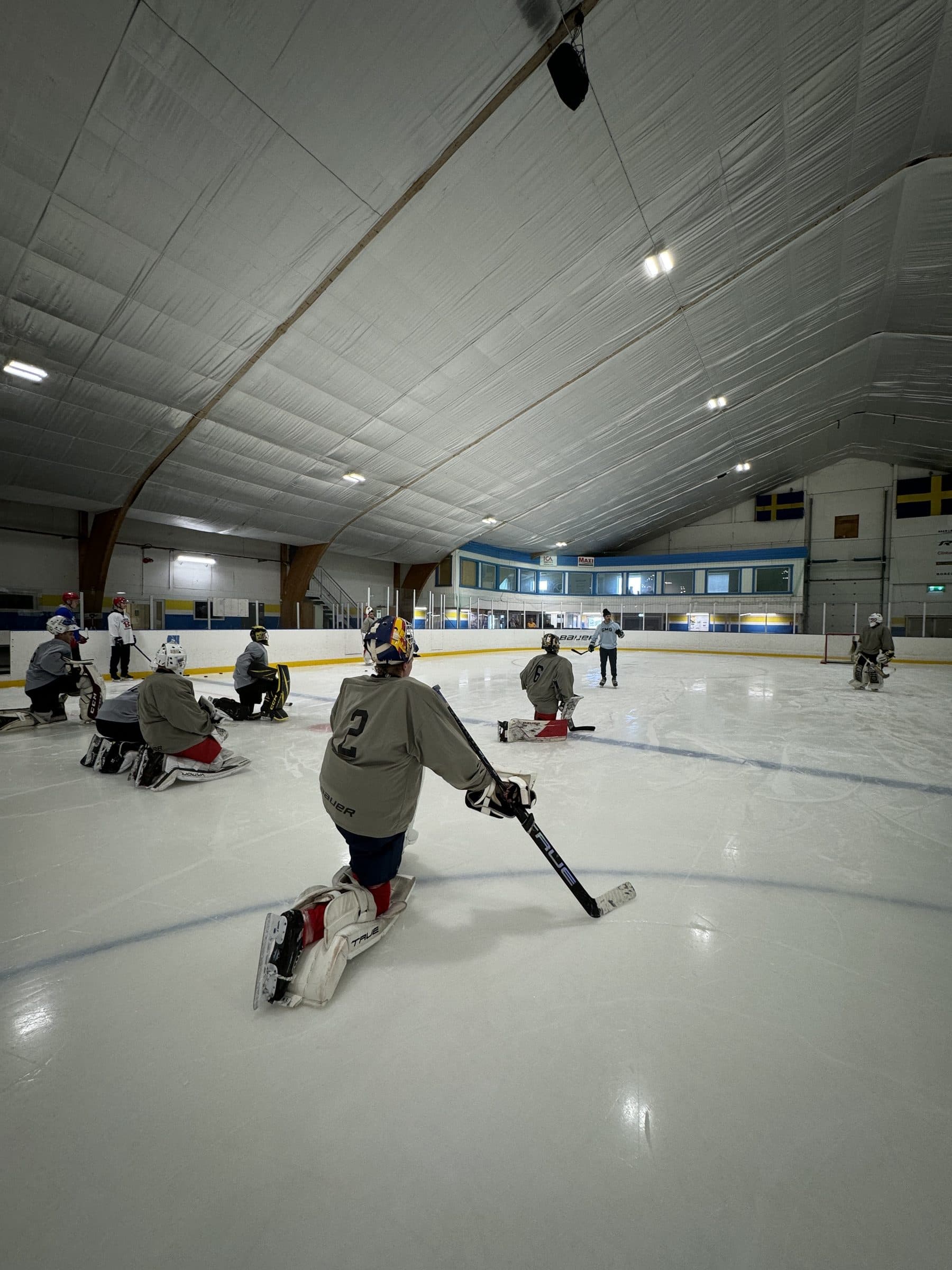 Goalies lined up during a GMG camp session